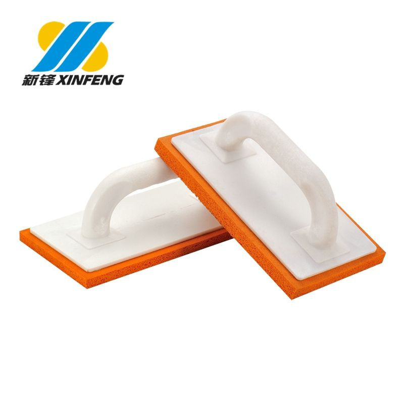orange plaster trowel with plastic handle
